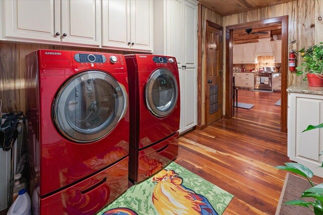 interior space with wooden walls and hardwood / wood-style floors