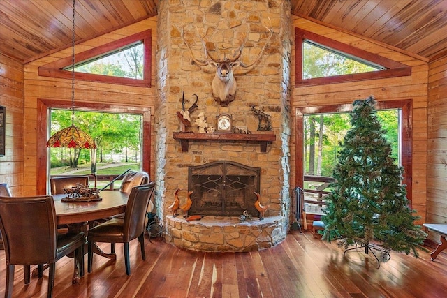 334 Pineknot Ln, Milam, TX 75959 - dining space with wood ceiling, wood walls, and hardwood / wood-style flooring