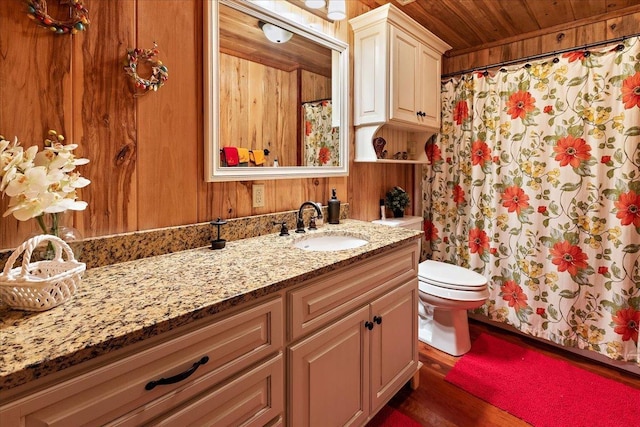 334 Pineknot Ln, Milam, TX 75959 - bathroom featuring toilet, curtained shower, wooden walls, wooden ceiling, and vanity