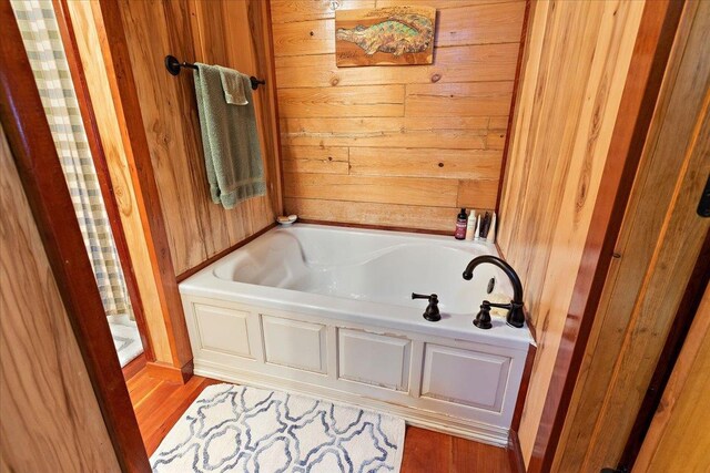 bathroom featuring wood walls, a shower with shower curtain, wooden ceiling, and vanity