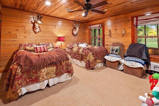 bathroom featuring wooden ceiling, toilet, wood walls, and vanity