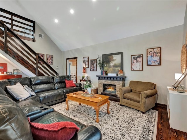 living room featuring high vaulted ceiling, stairway, visible vents, recessed lighting, and dark wood-style flooring