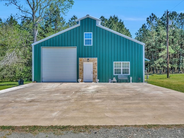 detached garage featuring driveway