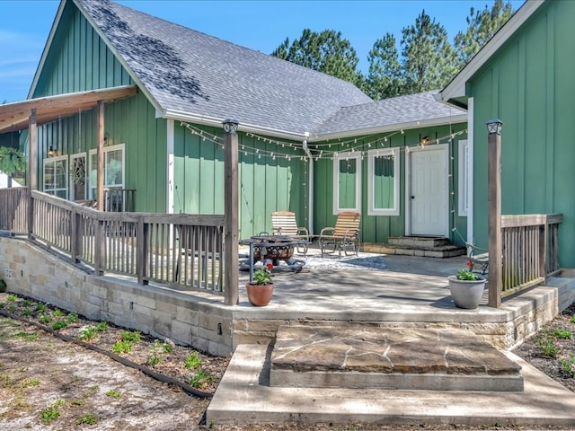 wooden terrace featuring entry steps and a patio area