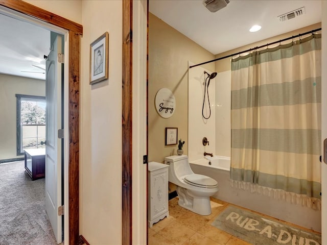full bath with visible vents, toilet, and shower / tub combo