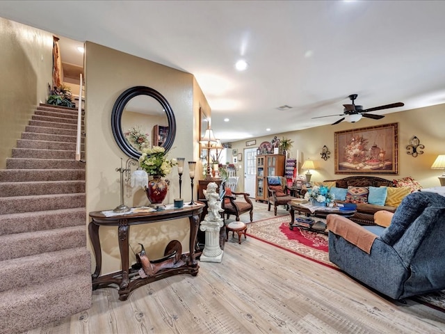 living room with stairs, recessed lighting, visible vents, a ceiling fan, and wood finished floors