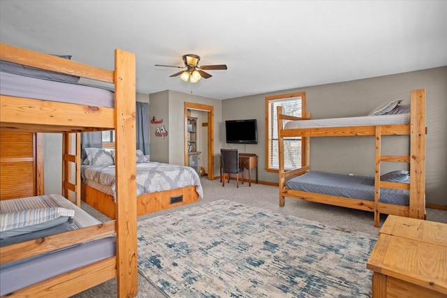bedroom featuring baseboards and carpet floors