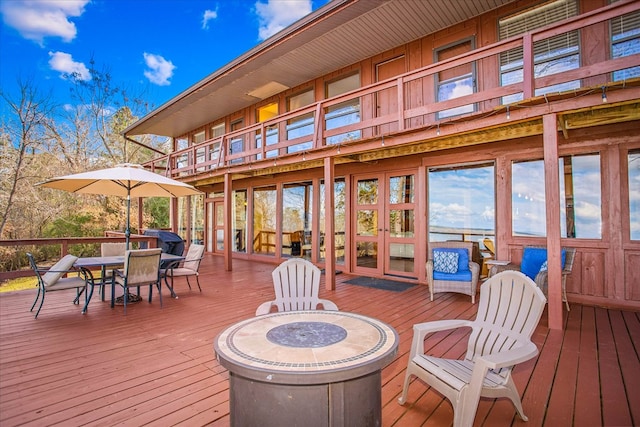 wooden deck with outdoor dining area