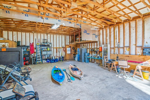 garage featuring stainless steel fridge