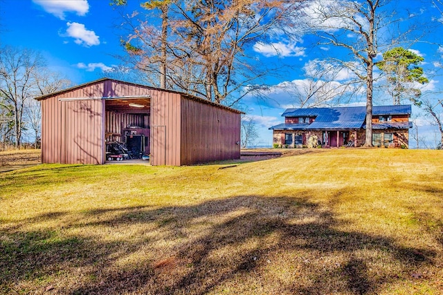 view of pole building with a yard