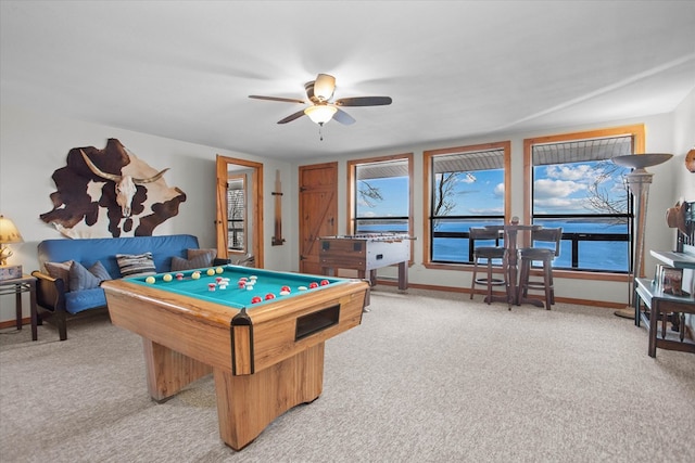 recreation room with light carpet, ceiling fan, and billiards