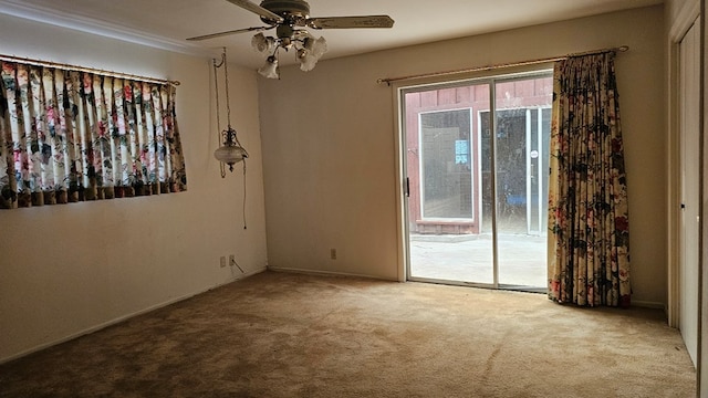 empty room with ceiling fan and light carpet