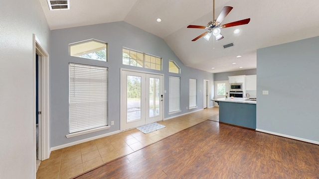 1780 County Road 293, Jasper, TX 75951 - kitchen featuring appliances with stainless steel finishes, white cabinetry, light countertops, ceiling fan, and high vaulted ceiling