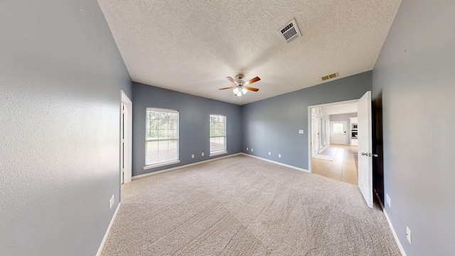 1780 County Road 293, Jasper, TX 75951 - carpeted empty room featuring baseboards, ceiling fan, and a textured ceiling