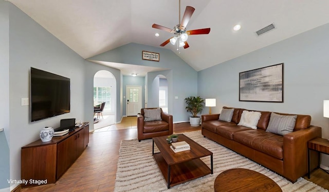 1780 County Road 293, Jasper, TX 75951 - living room with arched walkways, ceiling fan, lofted ceiling, and light wood finished floors