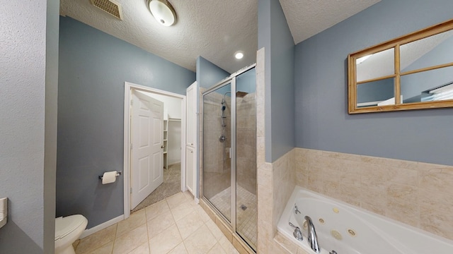 1780 County Road 293, Jasper, TX 75951 - bathroom with a shower stall, a whirlpool tub, tile patterned floors, a textured ceiling, and toilet