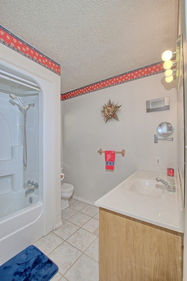 full bathroom featuring shower / bathing tub combination, vanity, tile patterned floors, toilet, and a textured ceiling