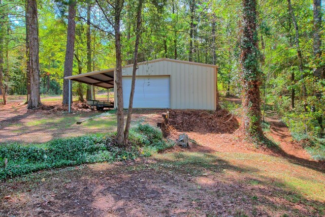 view of outdoor structure with a garage