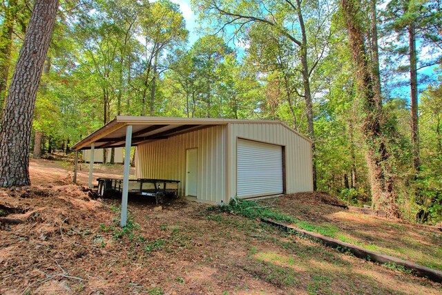 view of outbuilding with a garage