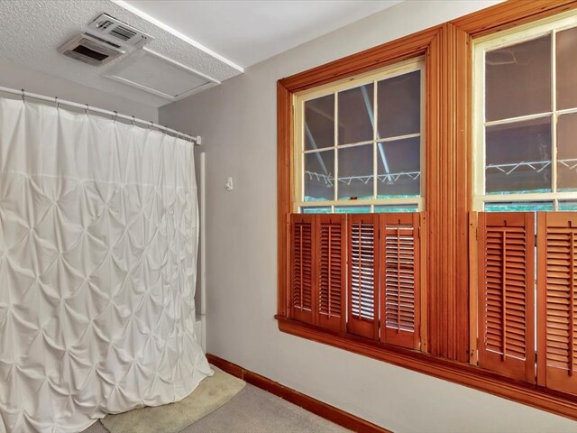 bathroom featuring a textured ceiling