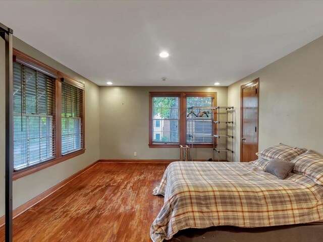 bedroom with hardwood / wood-style floors