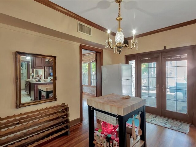 dining space featuring french doors, dark hardwood / wood-style flooring, and plenty of natural light