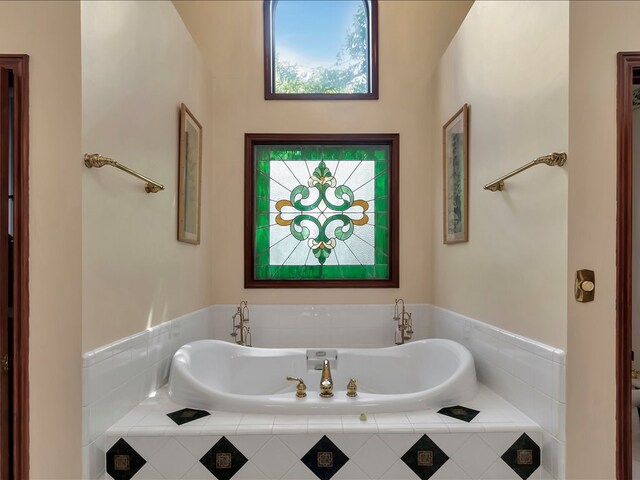 bathroom featuring a relaxing tiled tub