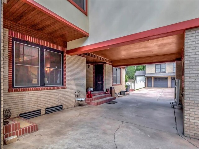 view of patio / terrace featuring a garage