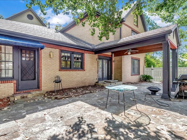 rear view of house with a patio area and ceiling fan