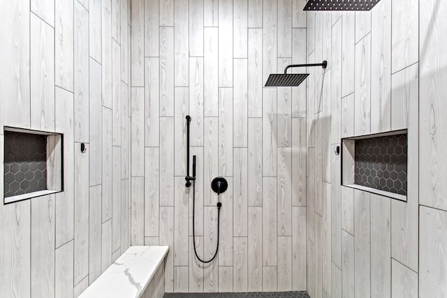 bathroom with tiled shower