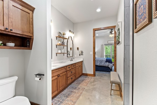 bathroom featuring concrete flooring, vanity, toilet, and ceiling fan