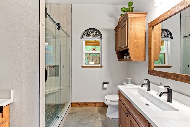 bathroom featuring vanity, toilet, an enclosed shower, and concrete floors