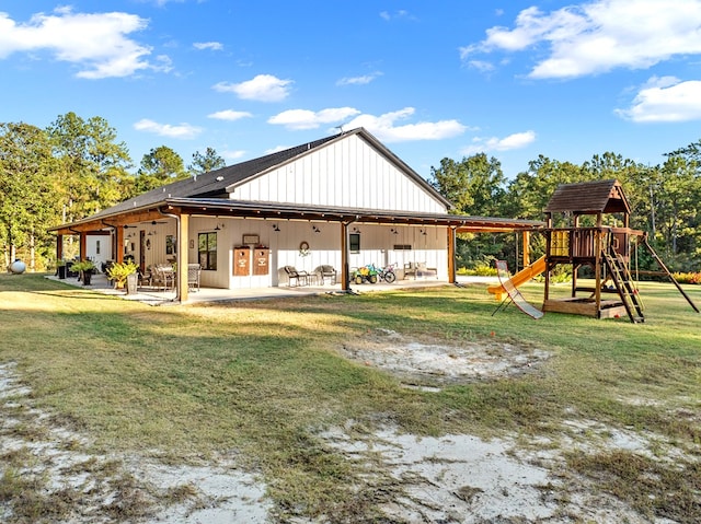 exterior space with a playground and a yard