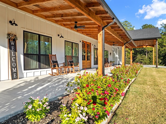 view of patio / terrace with ceiling fan and a porch