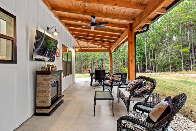 view of patio / terrace with ceiling fan and an outdoor living space