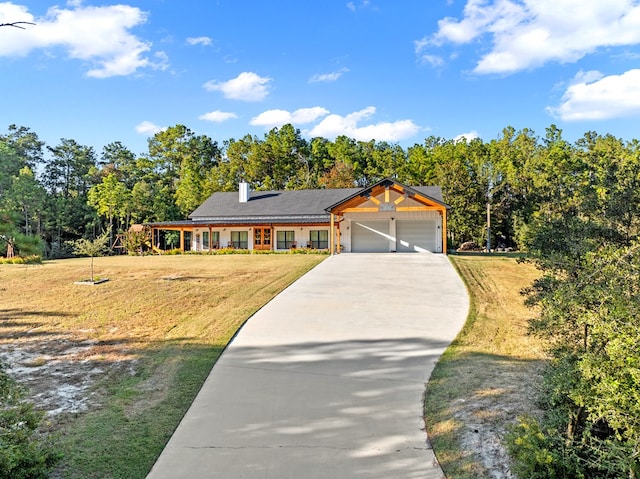 view of front facade with a garage and a front lawn