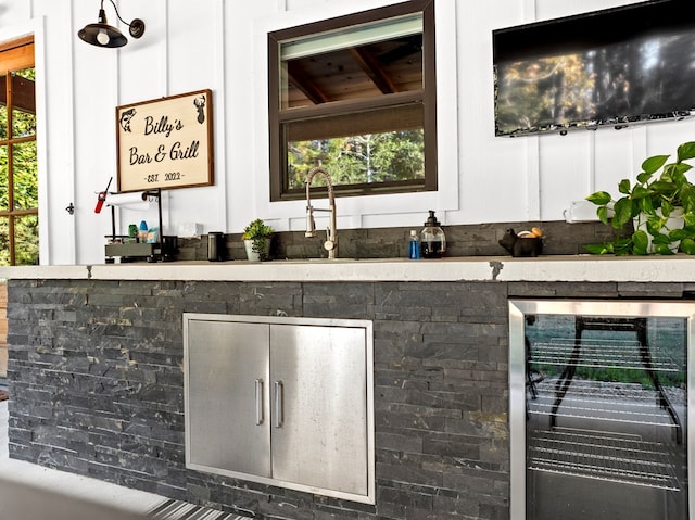 bar featuring wine cooler, white cabinets, and wooden ceiling