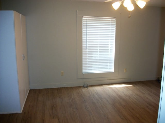 636 County Road 1165, Center, TX 75935 - spare room featuring wood finished floors, ceiling fan, and baseboards