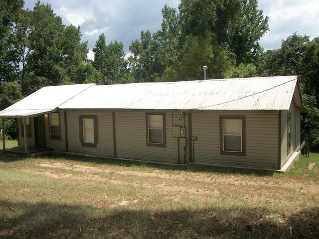 636 County Road 1165, Center, TX 75935 - view of front of home featuring a front yard, metal roof, and a porch