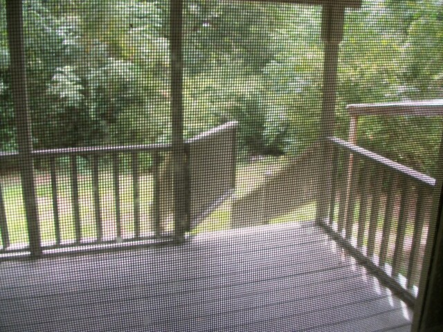 636 County Road 1165, Center, TX 75935 - deck with a tennis court