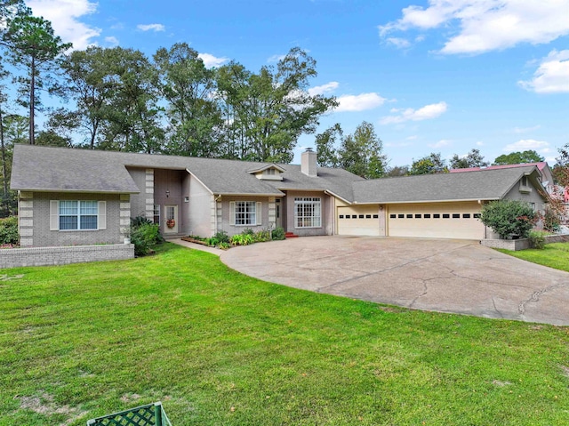 single story home with a garage and a front lawn