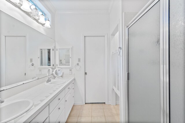 bathroom featuring vanity, tile patterned floors, walk in shower, and ornamental molding