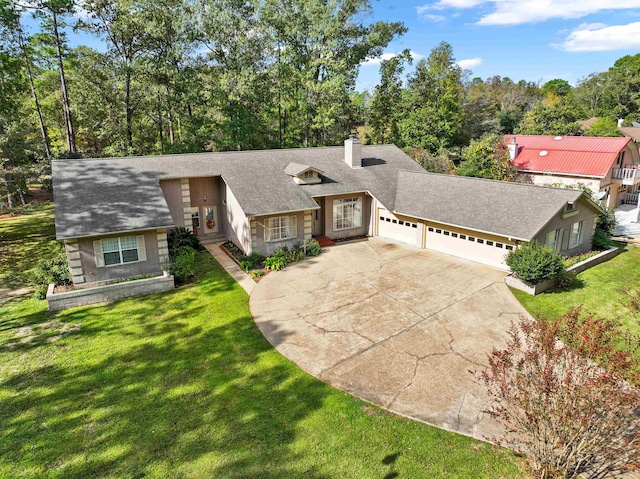 827 Duffer Dr, Brookeland, TX 75931 - view of front facade featuring an attached garage, a chimney, concrete driveway, a front yard, and roof with shingles