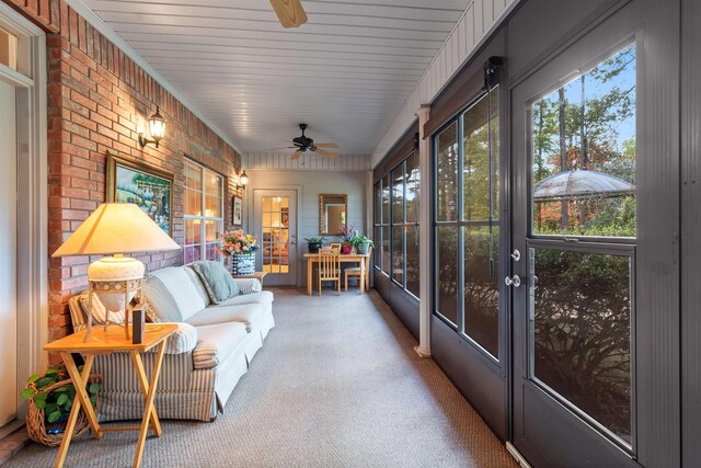 sunroom / solarium with ceiling fan