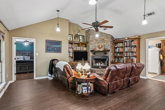 living room with a fireplace, dark hardwood / wood-style flooring, and high vaulted ceiling