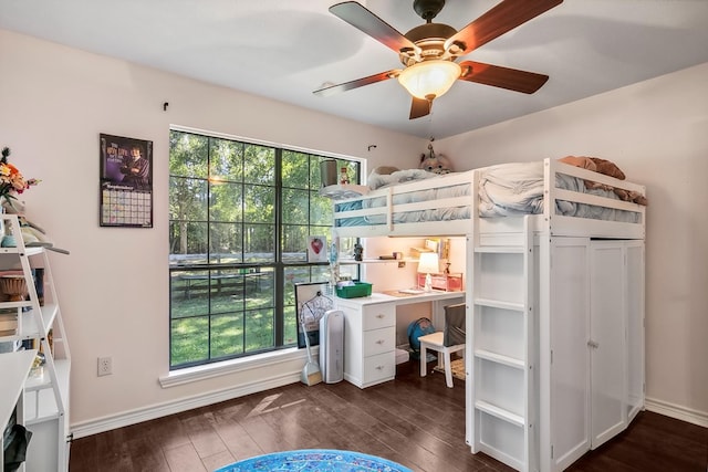 bedroom featuring dark hardwood / wood-style floors and ceiling fan