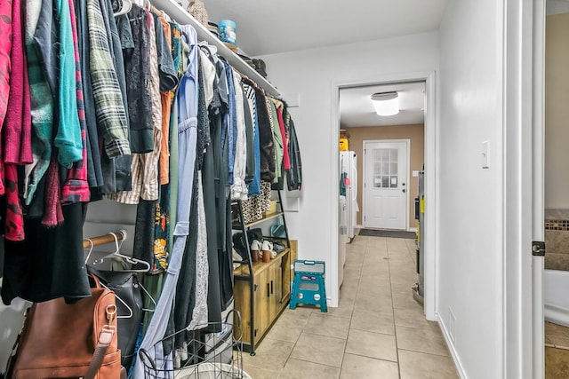 spacious closet featuring light tile patterned floors