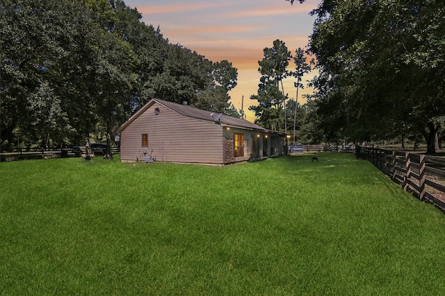 view of yard at dusk