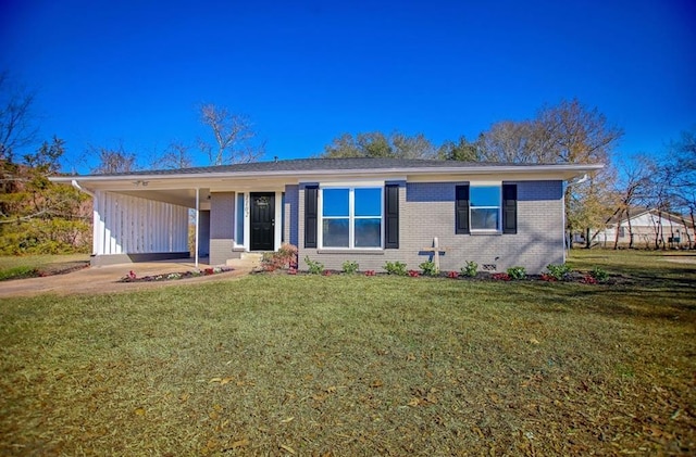 single story home featuring an attached carport, a front yard, brick siding, and driveway