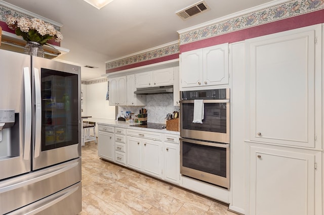 kitchen featuring white cabinets, backsplash, crown molding, and appliances with stainless steel finishes